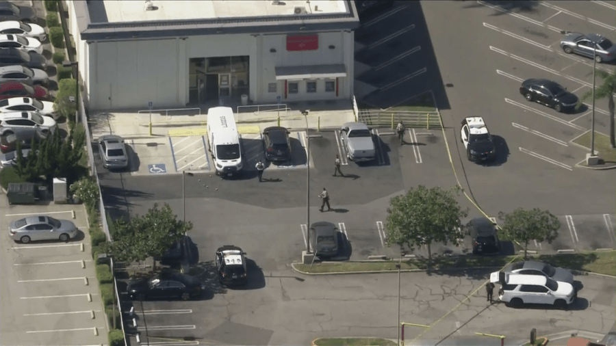 Los Angeles County Sheriff's Department officials respond to a shooting outside a Bank of America in Carson on Oct. 17, 2022. (KTLA)