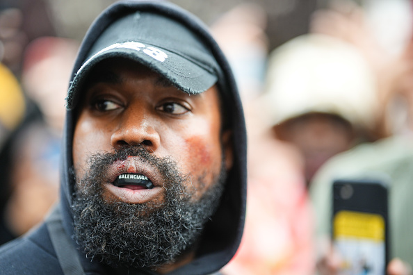 Kanye West aka Ye is seen wearing a Balenciaga boxing mouthguard during Paris Fashion Week on Oct. 2, 2022 in Paris. (Edward Berthelot/GC Images)