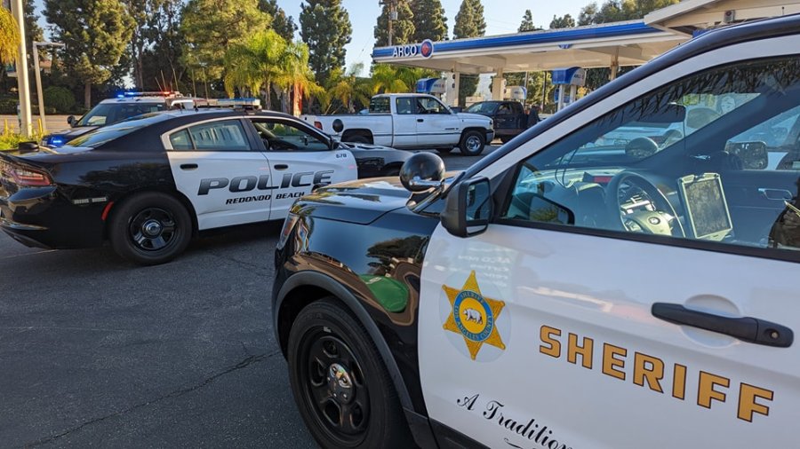 A photo posted on the Lomita Sheriff's Station Facebook page shows deputies stopping a hit-and-run suspect in Rolling HIlls Estates on Oct. 4, 2022.