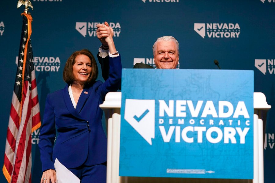 Sen. Catherine Cortez Masto, D-Nev., left, reacts alongside Nevada Gov. Steve Sisolak during an election night party hosted by the Nevada Democratic Party, Tuesday, Nov. 8, 2022, in Las Vegas. (AP Photo/Gregory Bull)