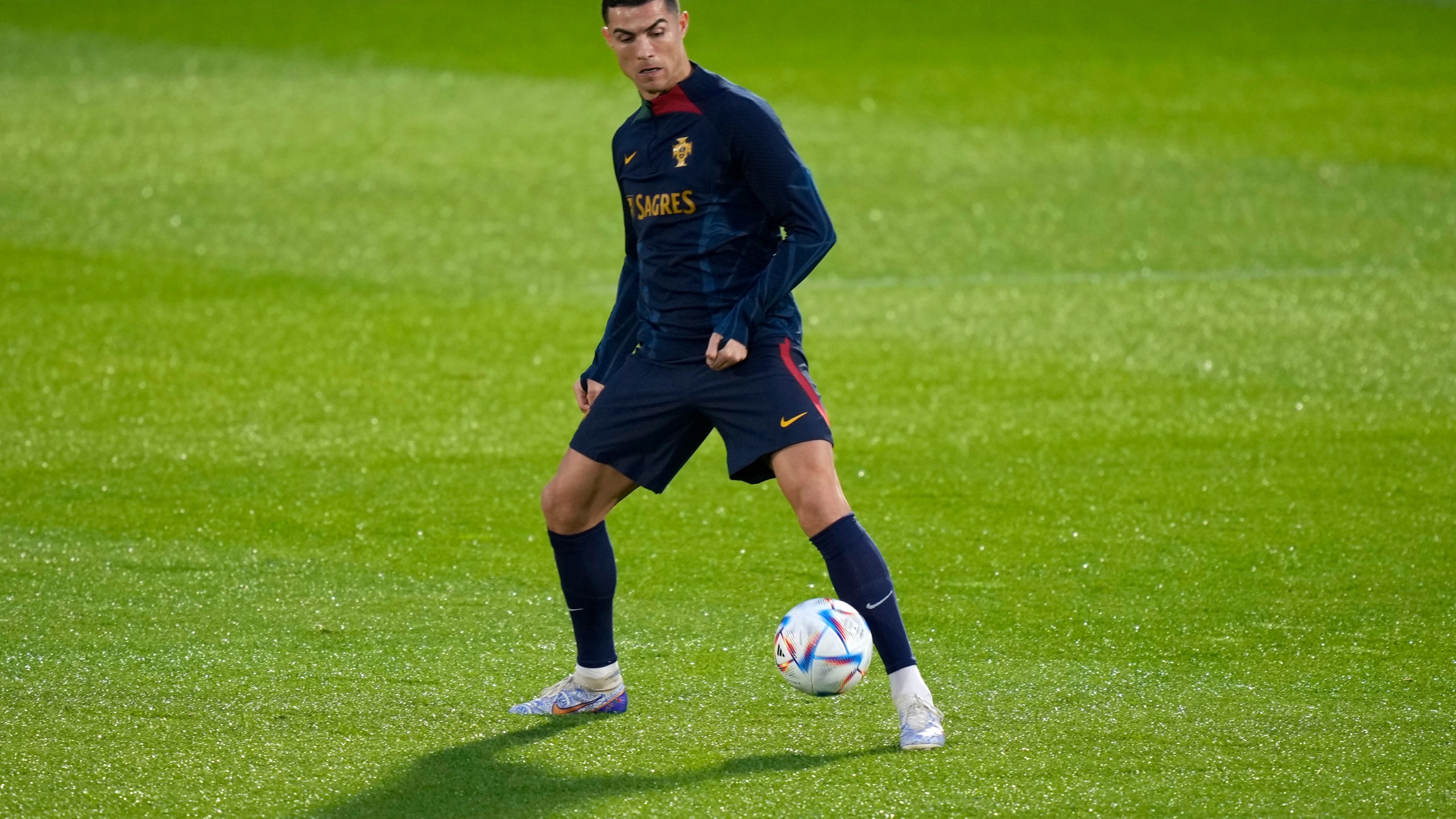 Cristiano Ronaldo plays with a ball during a Portugal soccer team training in Oeiras, outside Lisbon on Nov. 14, 2022. (Armando Franca/Associated Press)