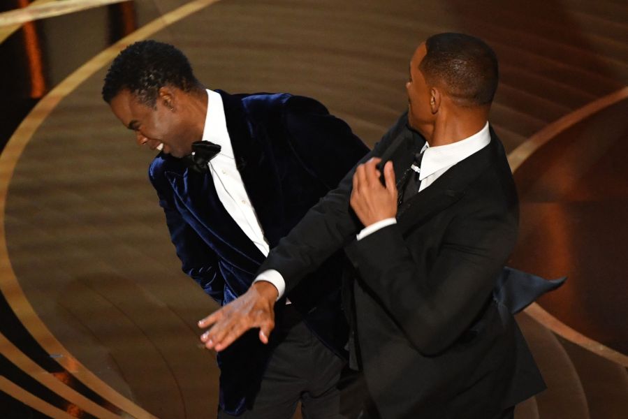 Will Smith, right, slaps Chris Rock onstage during the 94th Oscars at the Dolby Theatre in Hollywood, California, on March 27, 2022. (Robyn Beck / AFP via Getty Images)