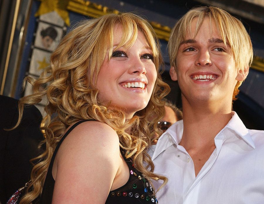 Actress Hilary Duff hugs singer Aaron Carter as they attend the premiere of "The Lizzie McGuire Movie" on April 26, 2003, in Hollywood, California. (Lucy Nicholson/Getty Images)