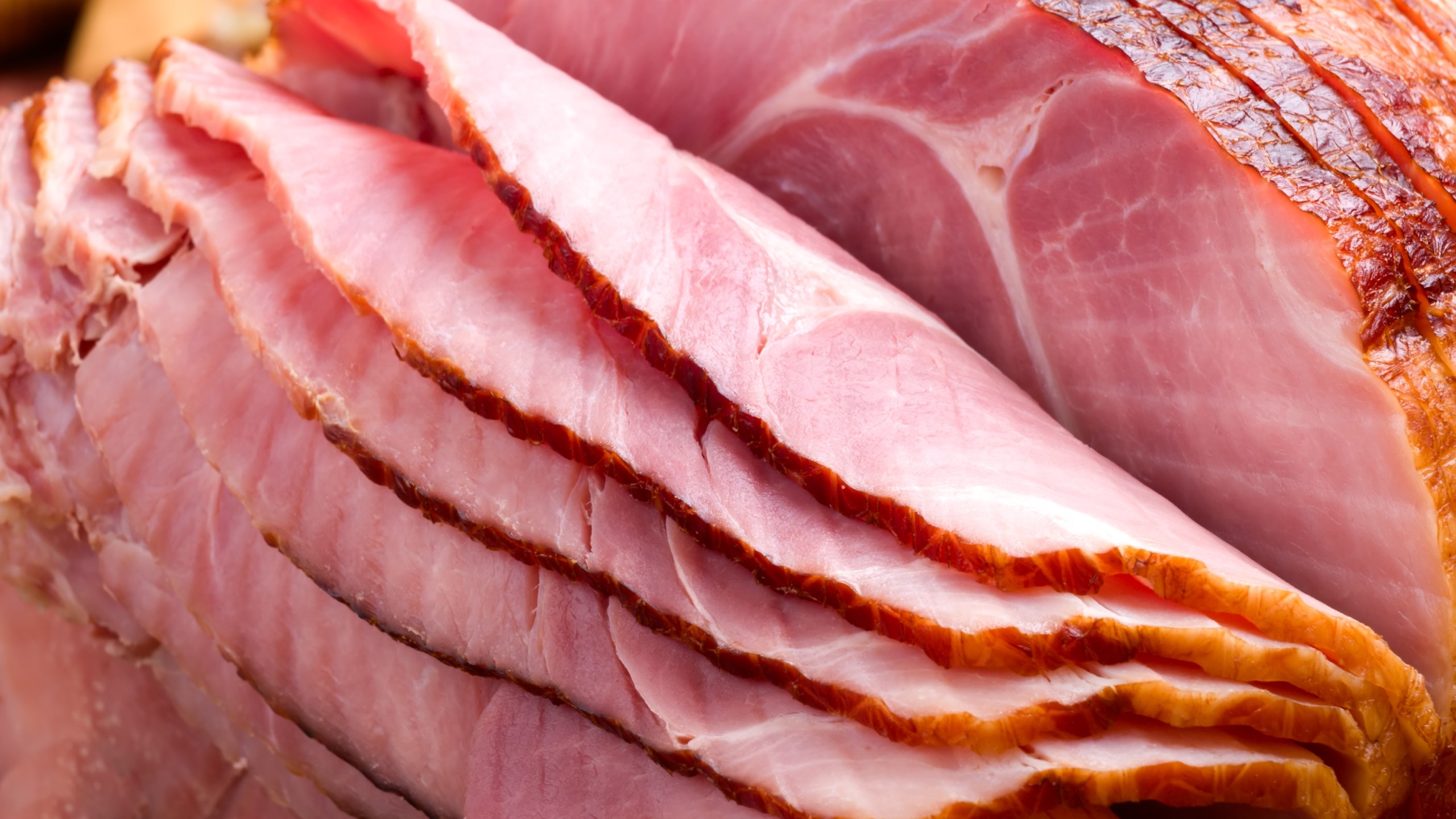 Carved slices of ham folding on top of one another are shown in this undated file photo. (Getty Images)