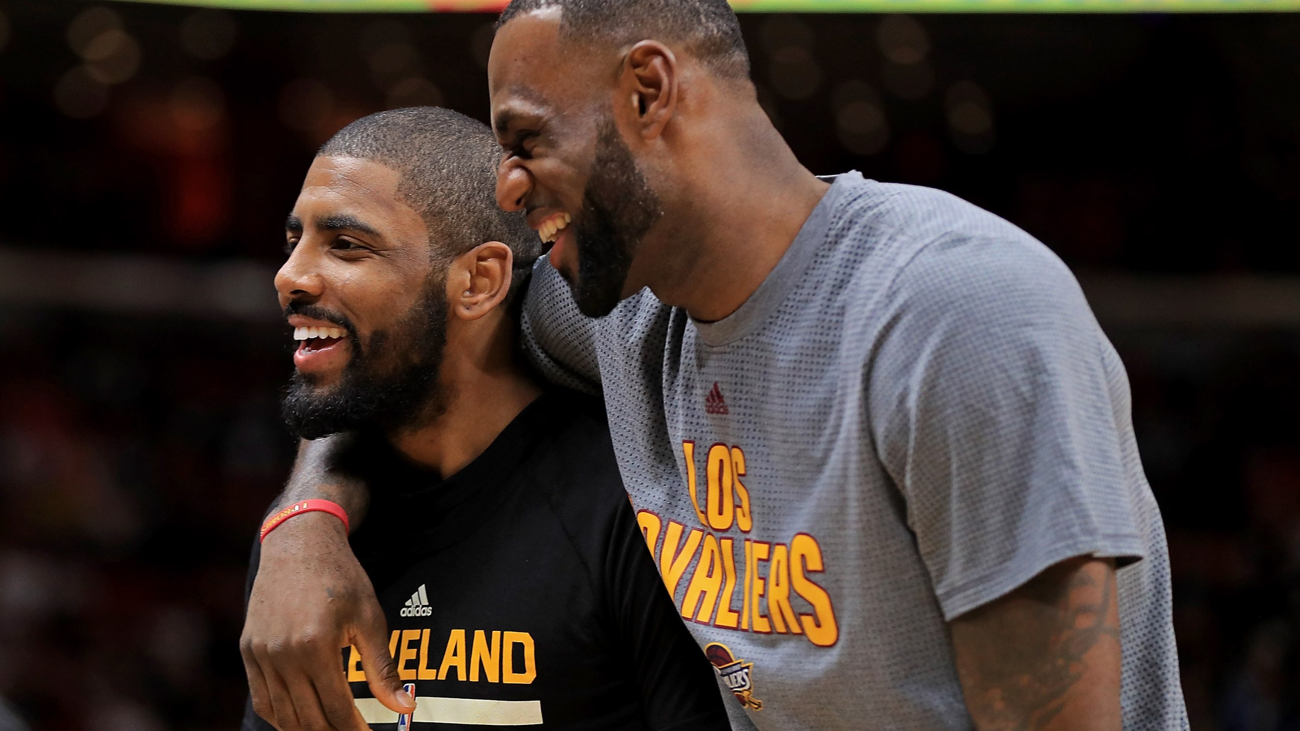 Kyrie Irving and LeBron James, then of the Cleveland Cavaliers, laugh during a game against the Miami Heat at American Airlines Arena on March 4, 2017, in Miami, Florida. (Mike Ehrmann/Getty Images)