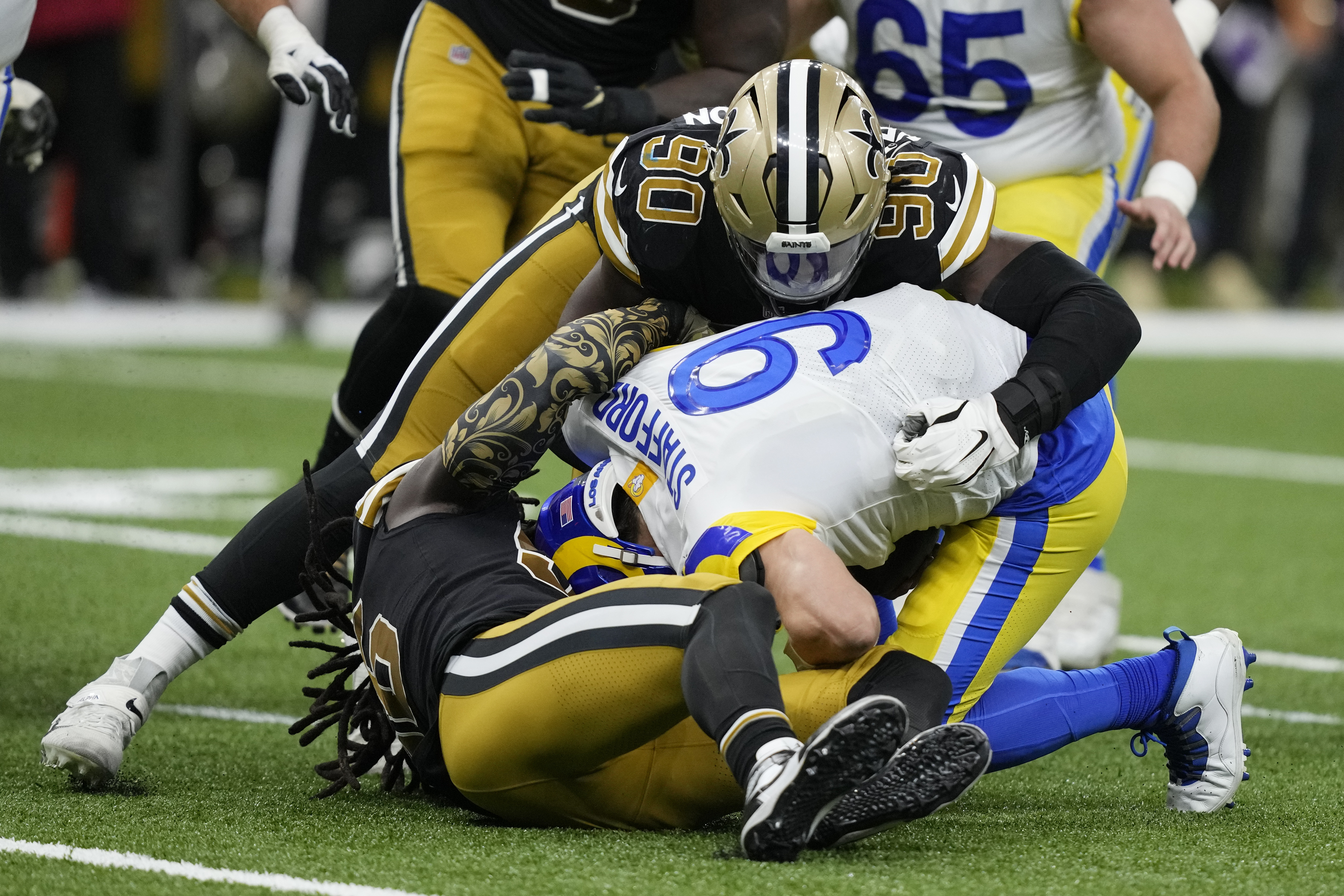 Los Angeles Rams quarterback Matthew Stafford is sacked by New Orleans Saints defensive end Tanoh Kpassagnon in the second half of an NFL football game in New Orleans, Sunday, Nov. 20, 2022. (AP Photo/Gerald Herbert)