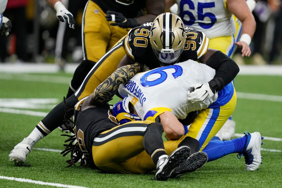 Los Angeles Rams quarterback Matthew Stafford is sacked by New Orleans Saints defensive end Tanoh Kpassagnon in the second half of an NFL football game in New Orleans, Sunday, Nov. 20, 2022. (AP Photo/Gerald Herbert)