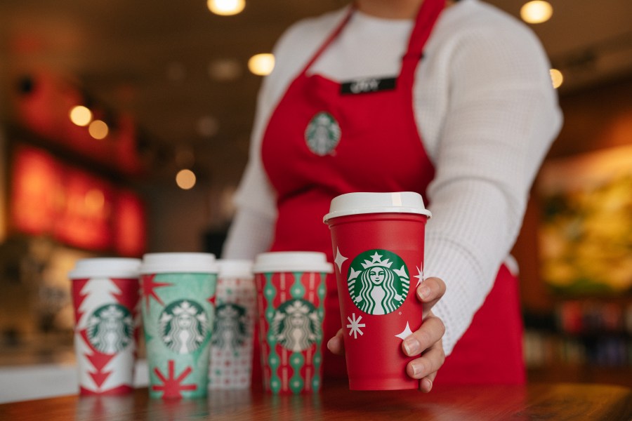 This year’s reusable red cups feature white starbursts and snowflakes for Nov. 17, 2022 in a photo provided by Starbucks.