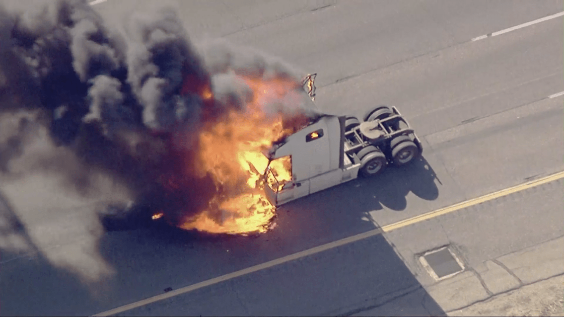 A stolen big rig is engulfed in flames following a pursuit along the 5 Freeway in the Santa Clarita Valley on Nov. 3, 2022. (KTLA)