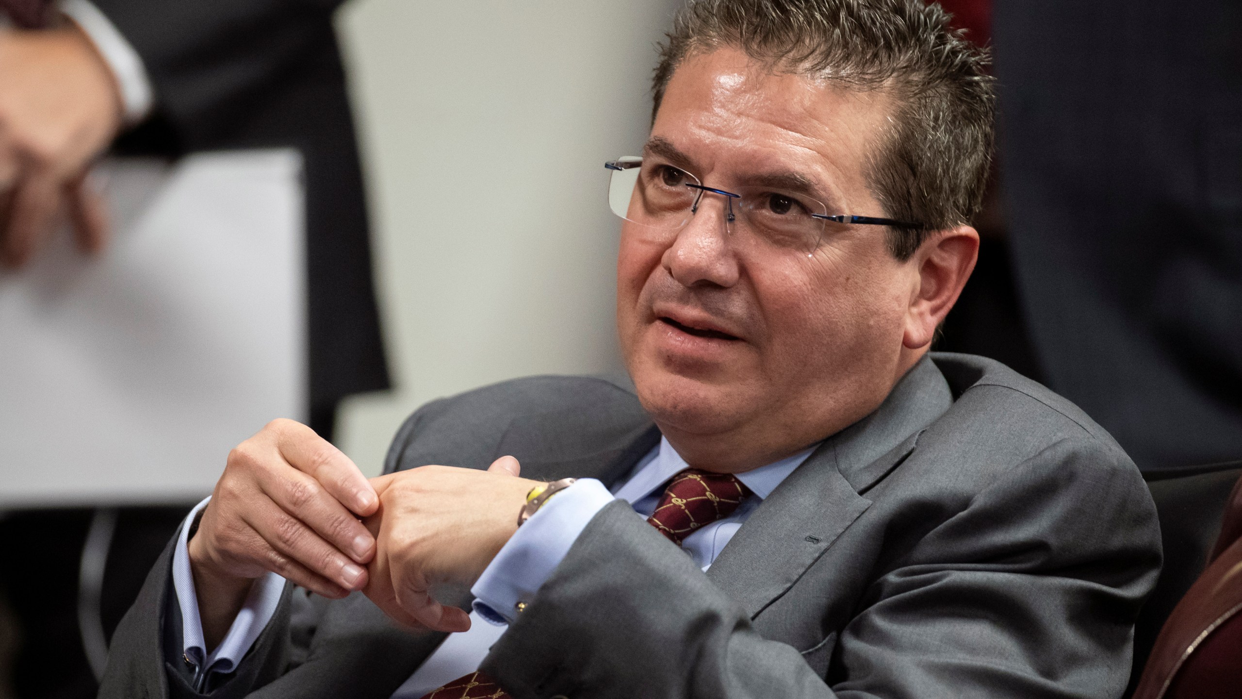 Washington Commanders owner Dan Snyder listens to head coach Ron Rivera during a news conference at the NFL team's training facility in Ashburn, Virginia, Jan. 2, 2020. (AP Photo/Alex Brandon, File)