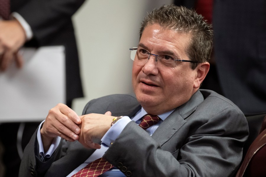 Washington Commanders owner Dan Snyder listens to head coach Ron Rivera during a news conference at the NFL team's training facility in Ashburn, Virginia, Jan. 2, 2020. (AP Photo/Alex Brandon, File)