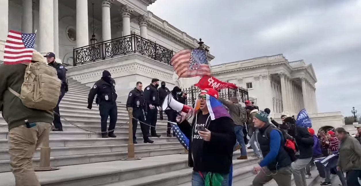 Eric Christie is seen in this still from a video taken on Jan. 6, 2021 and shared to YouTube by Tom Lemons. This video was included as evidence in the federal criminal complaint against Christie.