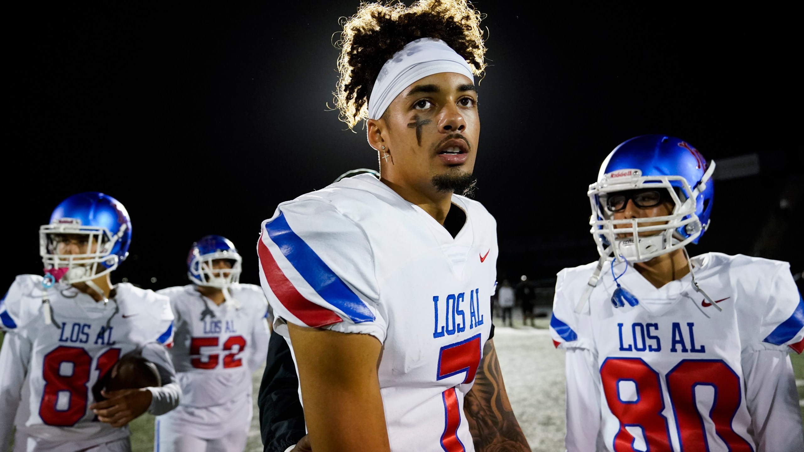 Los Alamitos High School quarterback Malachi Nelson stands on the field after a high school football game against Newport Harbor High School on Friday, Sept. 30, 2022, in Newport Beach, Calif. (AP Photo/Ashley Landis)