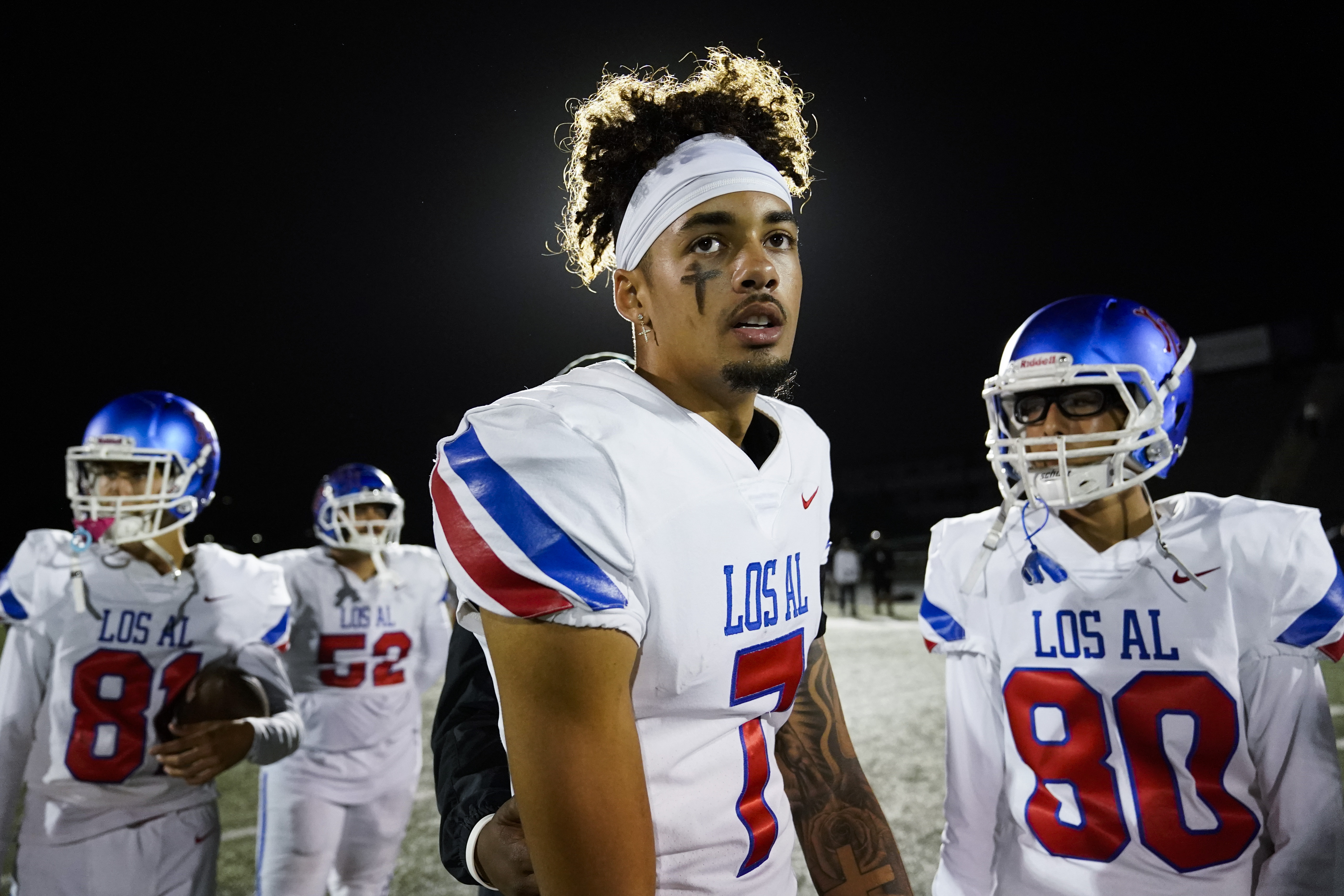 Los Alamitos High School quarterback Malachi Nelson stands on the field after a high school football game against Newport Harbor High School on Friday, Sept. 30, 2022, in Newport Beach, Calif. (AP Photo/Ashley Landis)