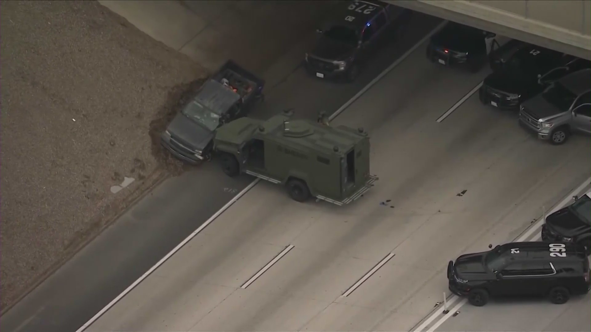 Image from Sky5 shows the end of a pursuit on the southbound 15 Freeway in Norco involving the suspect in a deadly shooting with a Riverside County Sheriff's deputy