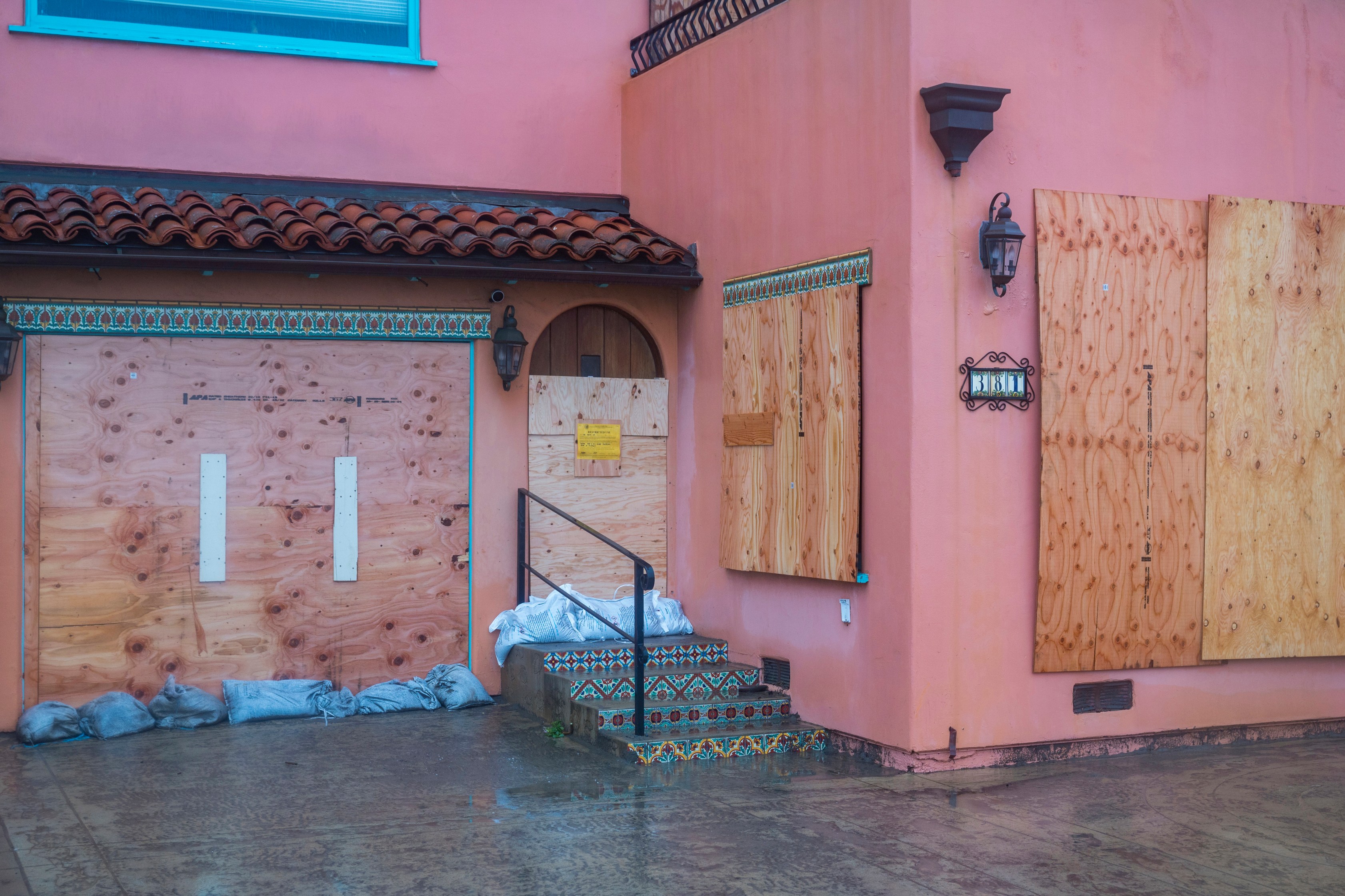 A boarded up house on Beach Drive in Aptos, Calif., on Jan. 9, 2023. (Nic Coury/Associated Press)