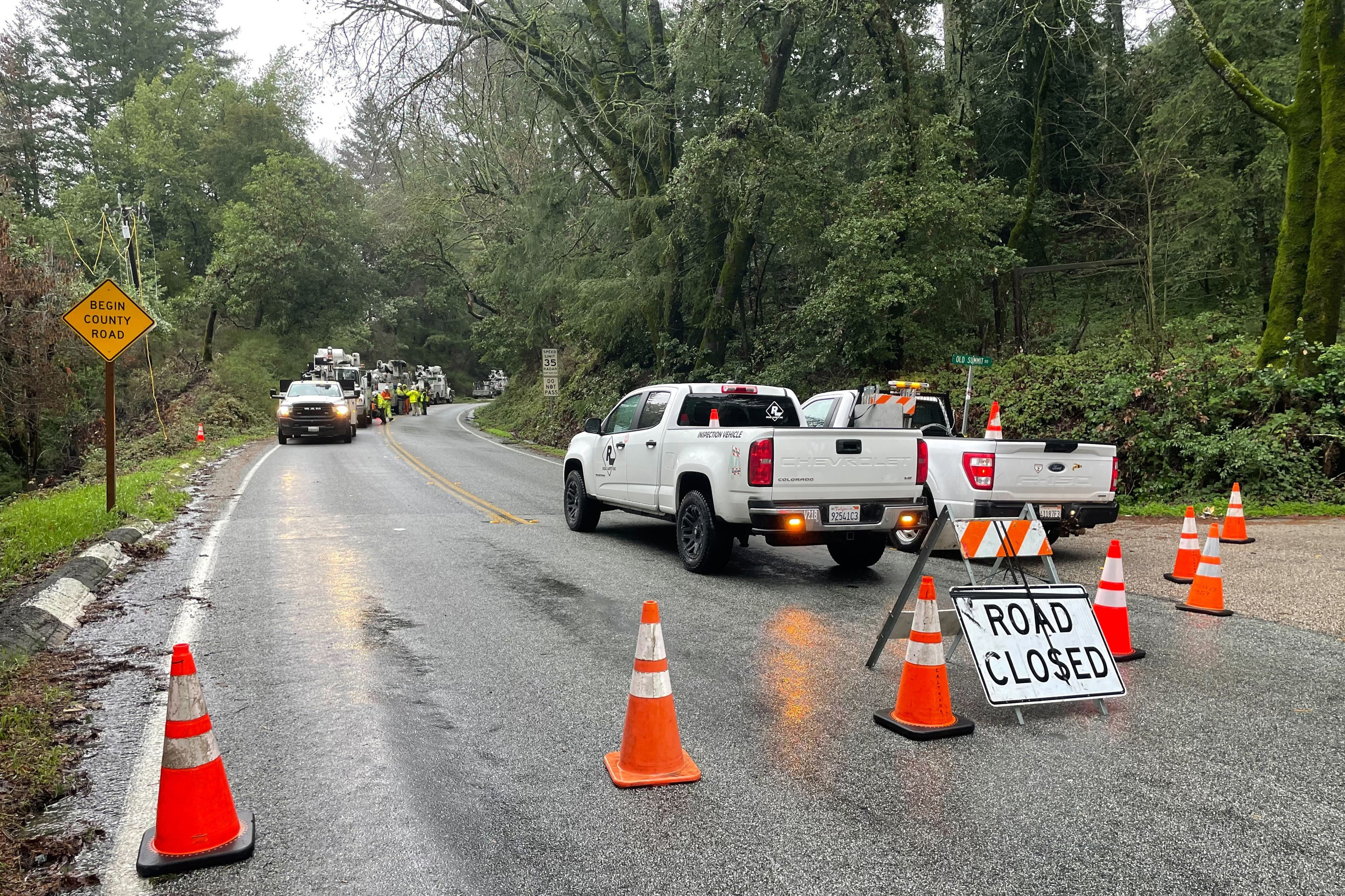 The closed Summit Road is blocked as emergency personnel are deployed in the area in Santa Clara County, Calif., on Jan. 9, 2023. (Haven Daley/Associated Press)