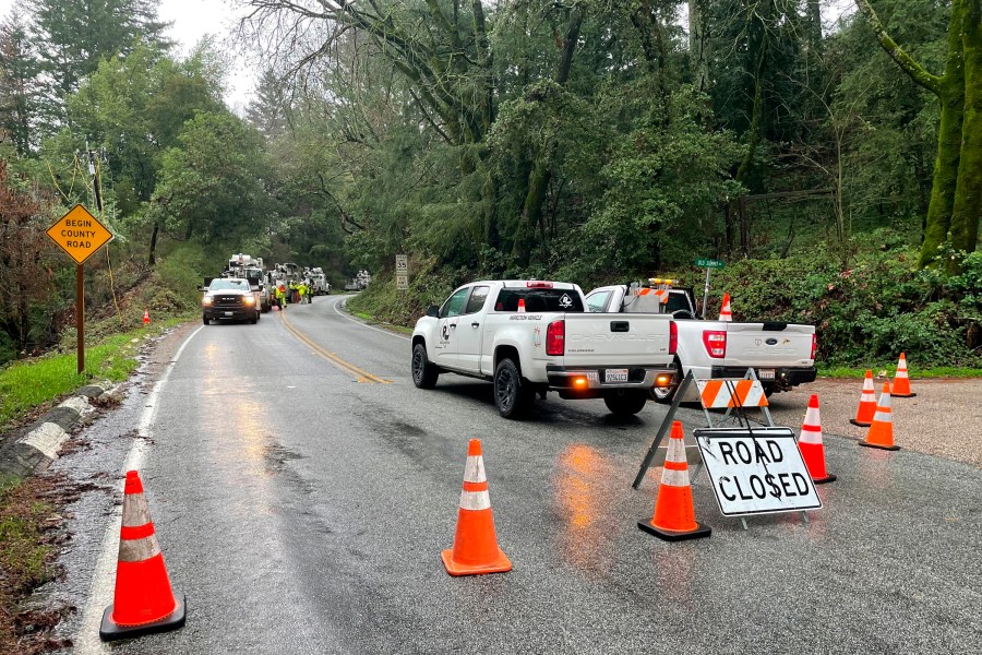 The closed Summit Road is blocked as emergency personnel are deployed in the area in Santa Clara County, Calif., on Jan. 9, 2023. (Haven Daley/Associated Press)