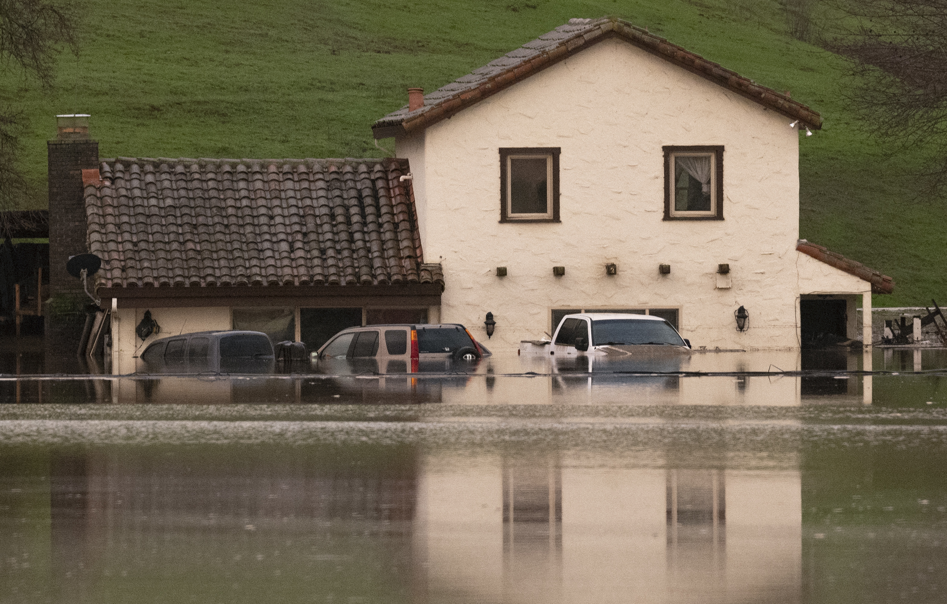 A flooded house is seen partially underwater in Gilroy, California, on Jan. 9, 2023. (JOSH EDELSON/AFP via Getty Images)