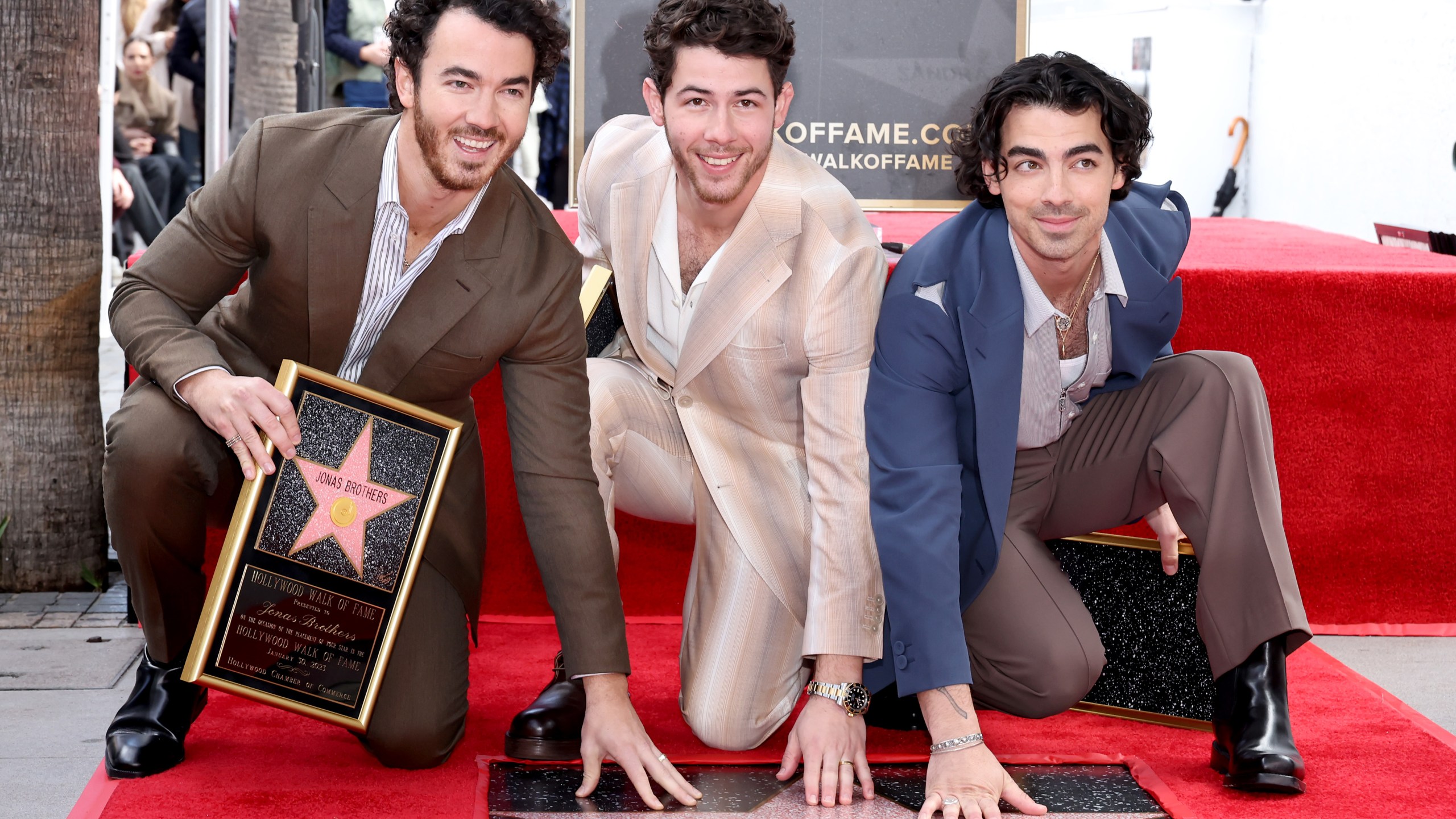 (L-R) Kevin Jonas, Nick Jonas, and Joe Jonas of The Jonas Brothers attend their Hollywood Walk of Fame star ceremony on Jan. 30, 2023. (Amy Sussman/Getty Images)