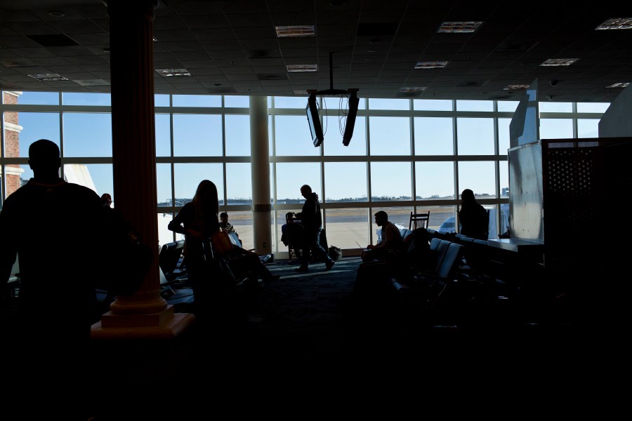 Passengers wait in Montgomery Regional Airport on Nov. 26, 2014, in Montgomery, Ala. A member of an airline ground crew working at the Alabama airport died Saturday afternoon, Dec. 31, 2022, in an accident at the facility. (AP Photo/Brynn Anderson, File)