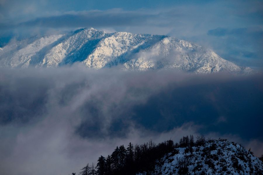 Mount Baldy is covered in snow in the Angeles National Forest north of Los Angeles, California on Dec. 26, 2019, after a cold winter storm brought heavy rain, snow and strong winds to much of Southern California. (Robyn Beck / AFP via Getty Images)