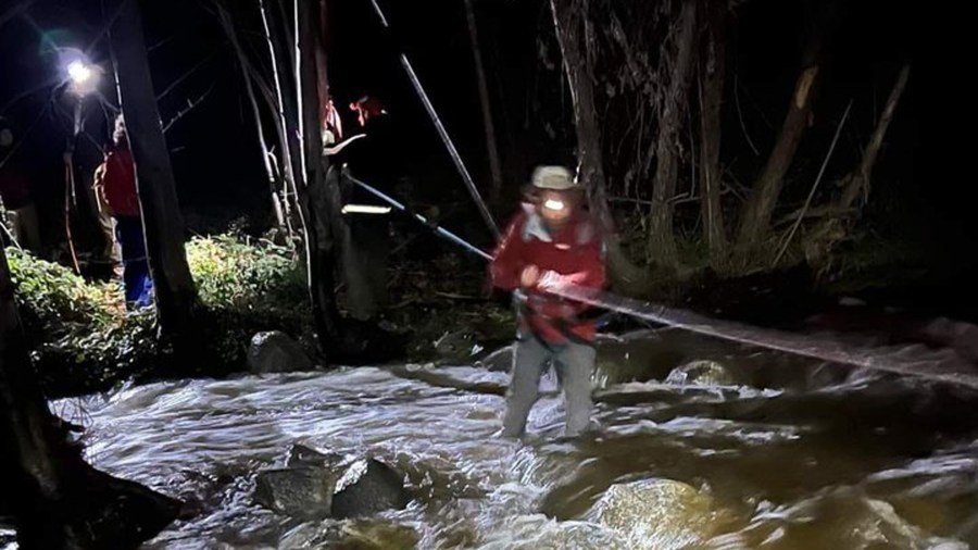 A stranded hiker uses ropes to cross over a swollen river in the Angeles National Forest on Jan. 8, 2023. (Montrose Search and Rescue Team)