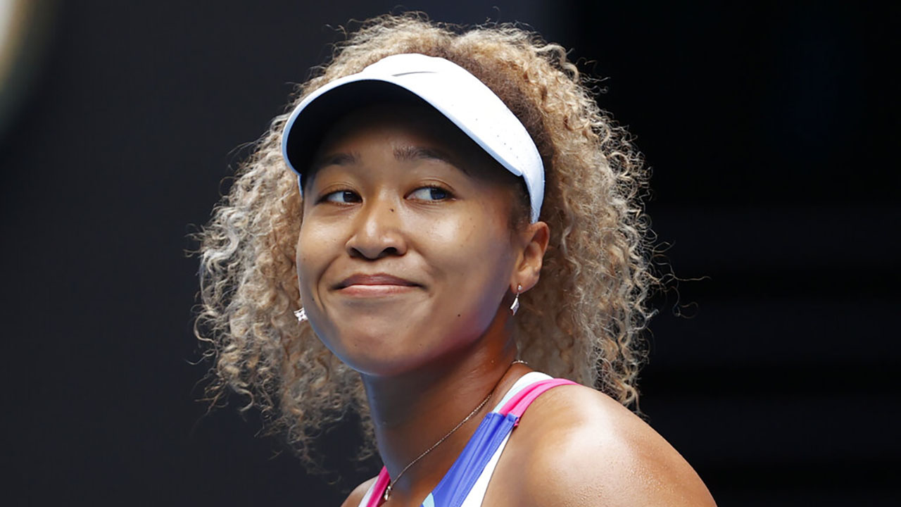 Naomi Osaka of Japan smiles during her first round match against Camila Osorio of Colombia at the Australian Open tennis championships in Melbourne, Australia on Jan. 17, 2022. (Simon Baker/Associated Press)