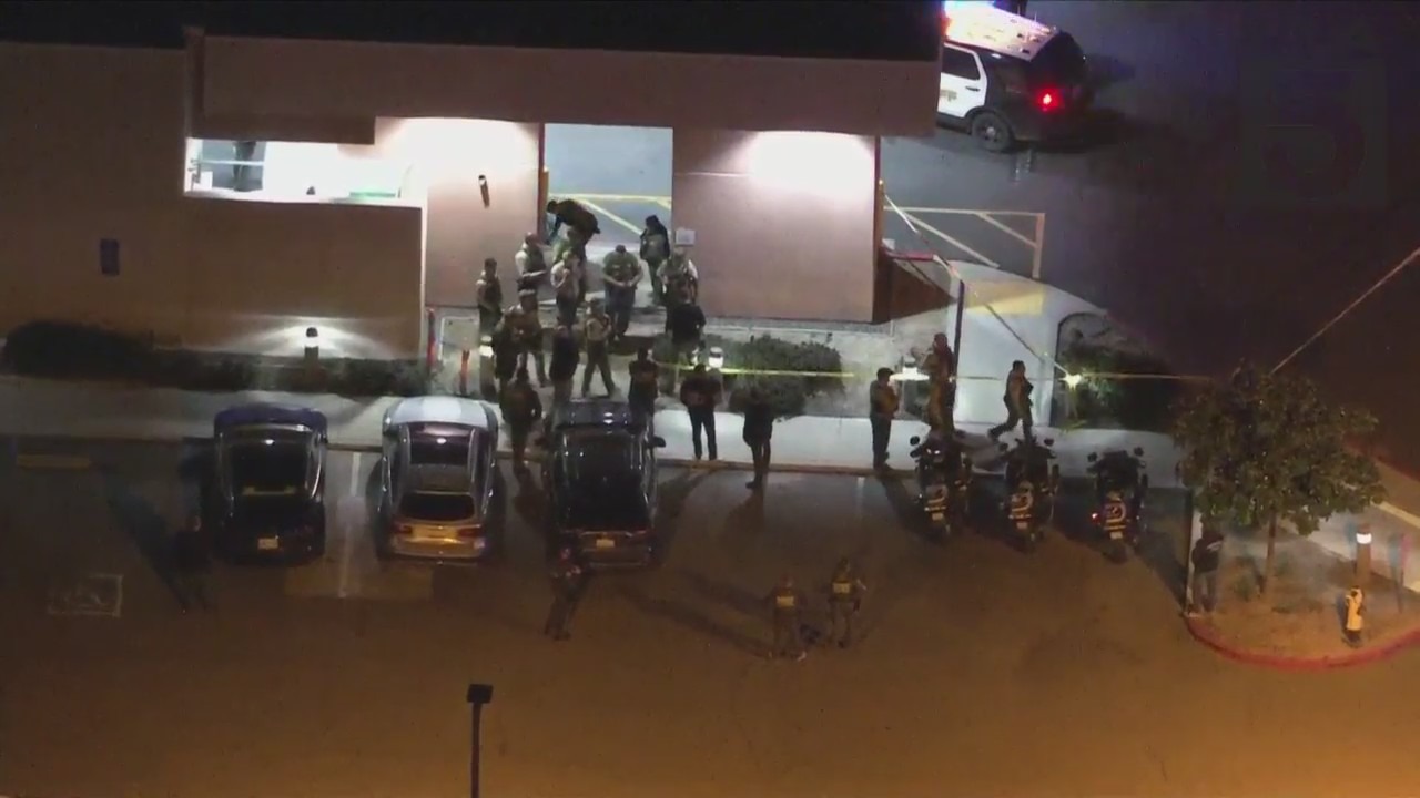 Authorities outside hospital where Riverside County Sheriff's Deputy was taken after being shot in Lake Elsinore on Jan. 13, 2023. (KTLA)