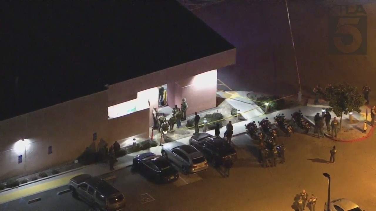 Authorities outside hospital where Riverside County Sheriff's Deputy was taken after being shot in Lake Elsinore on Jan. 13, 2023. (KTLA)