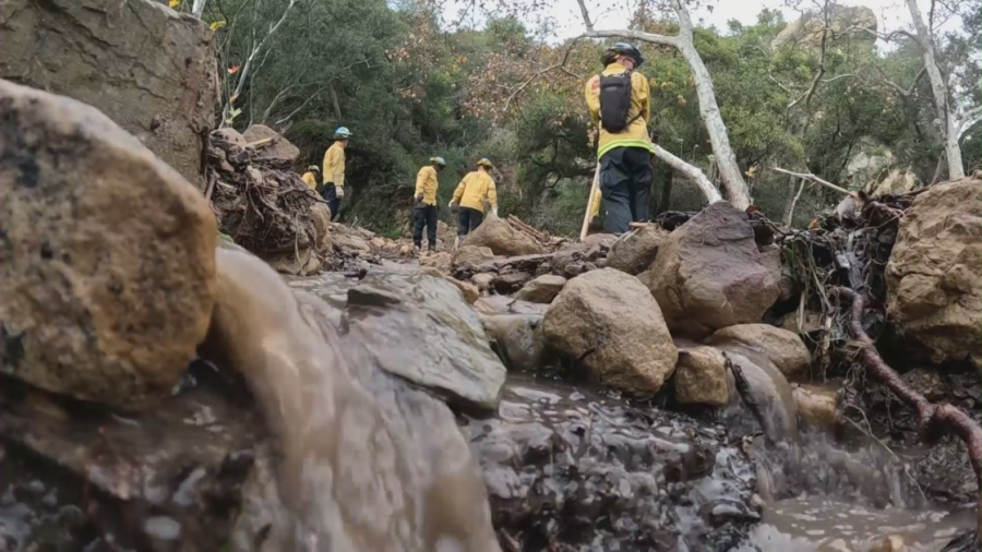 Crews in Montecito on Jan. 11, 2023 work to clean up the mess left behind by a powerful winter storm that slammed Southern California. (KTLA)