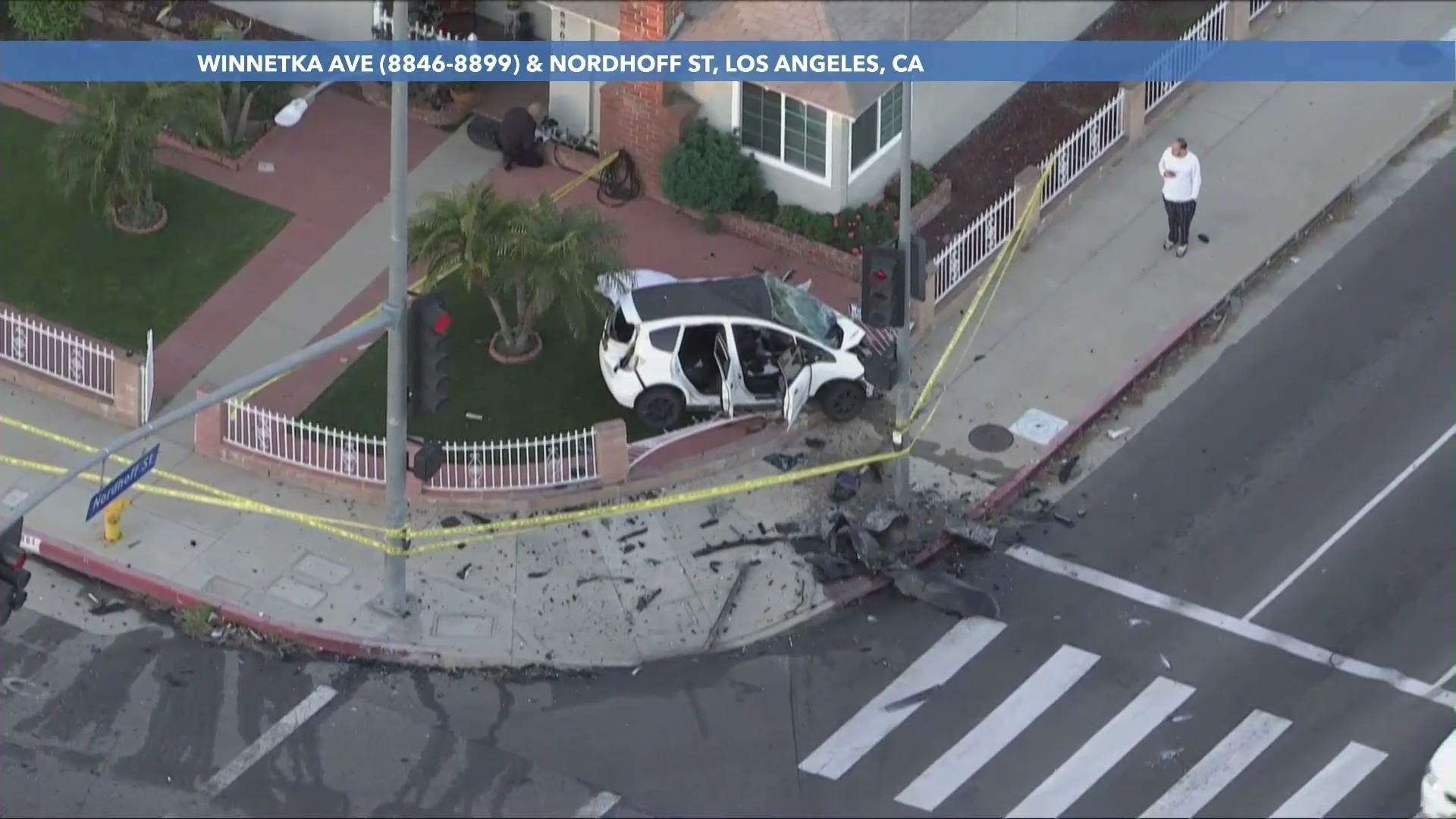 A head-on crash in Chatsworth on Feb. 9, 2023, killed a person and sent their car onto a home's front yard. (KTLA)