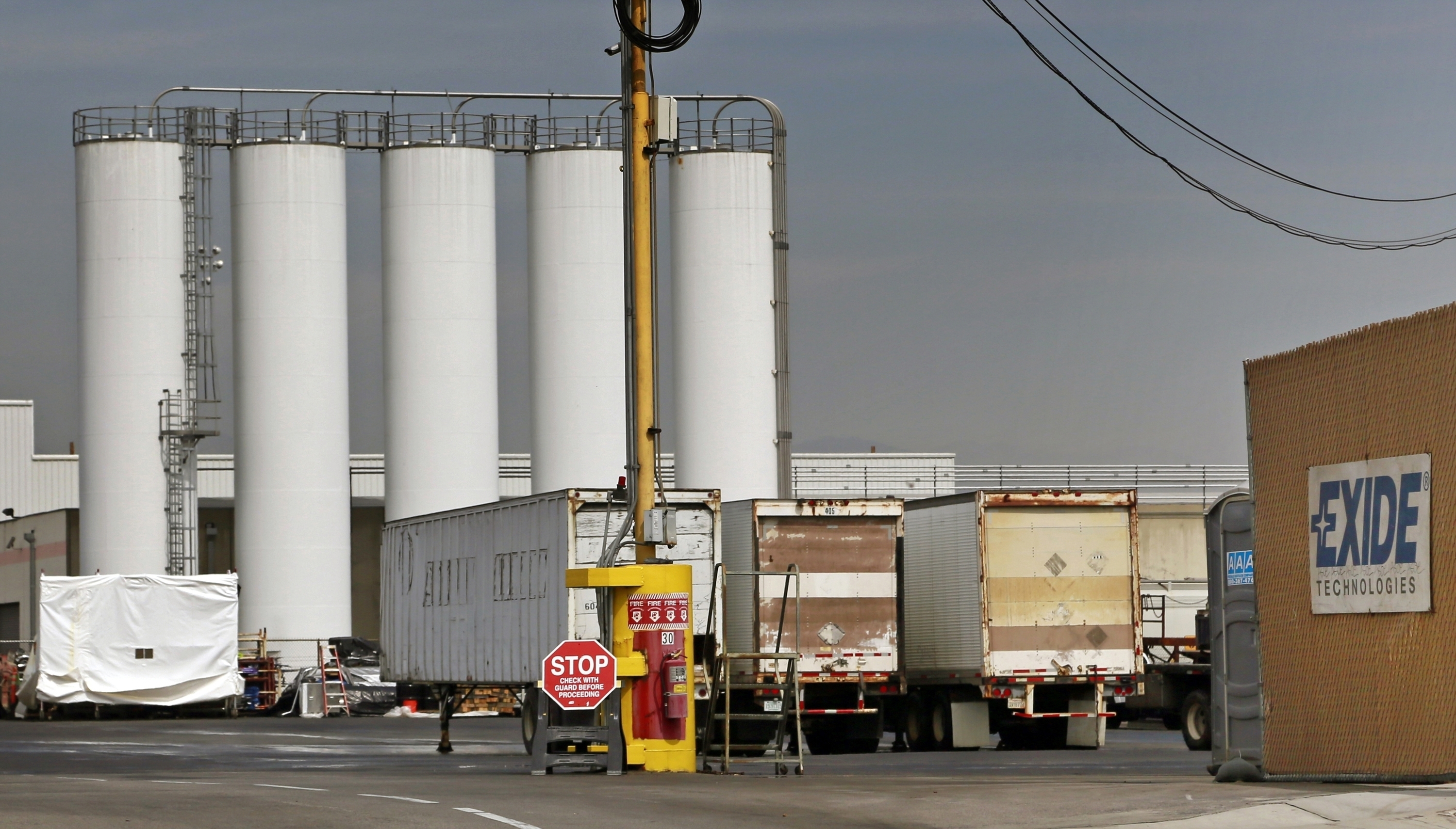 The Exide Technologies battery recycling plant is seen in Vernon, Calif., on March 10, 2015. Members of Congress are calling on the federal government to help clean up toxic lead contamination from the former battery recycling plant outside Los Angeles. (AP Photo/Nick Ut, File)