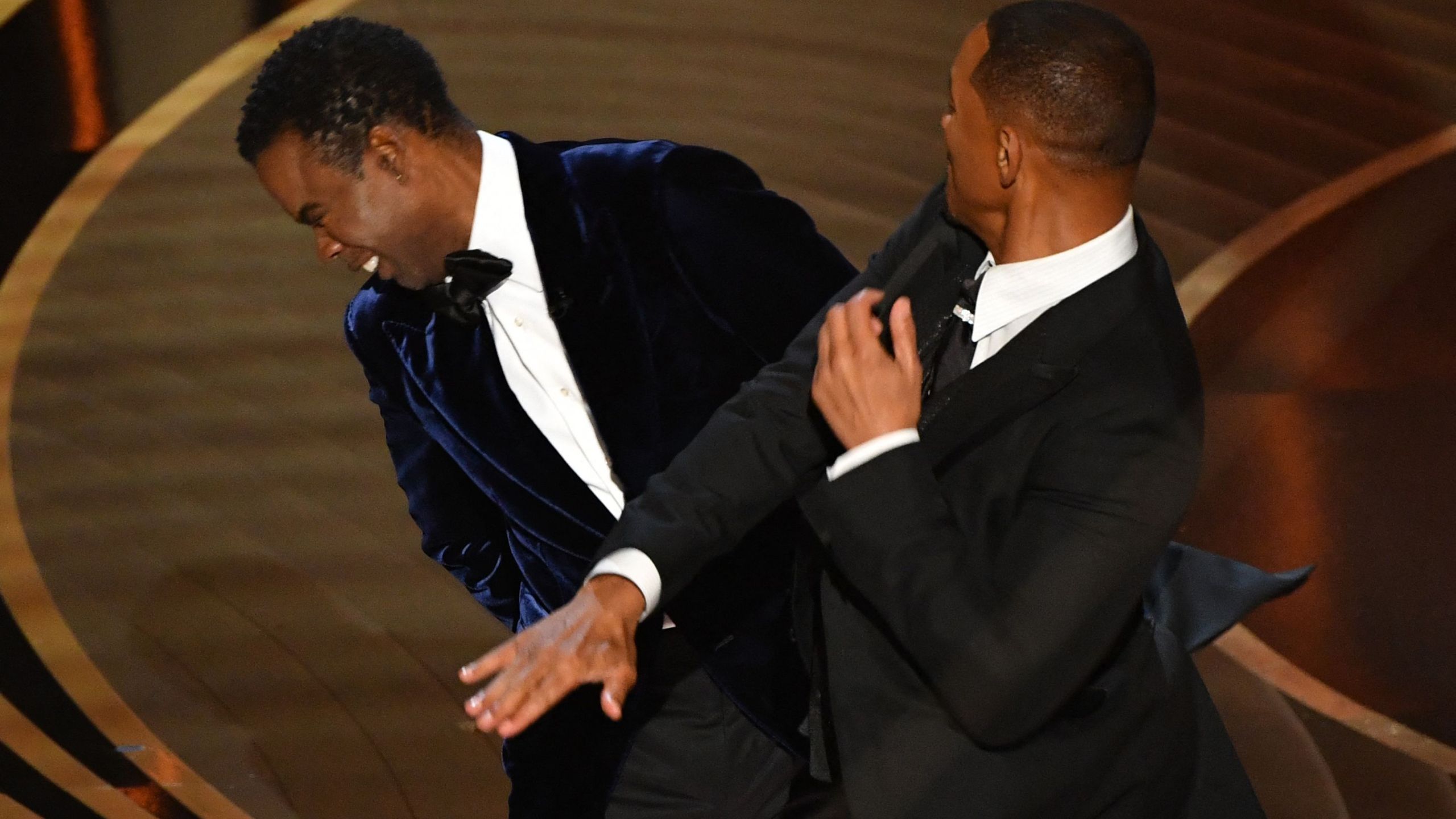 Will Smith, right, slaps Chris Rock onstage during the 94th Oscars at the Dolby Theatre in Hollywood on March 27, 2022. (Robyn Beck / AFP via Getty Images)