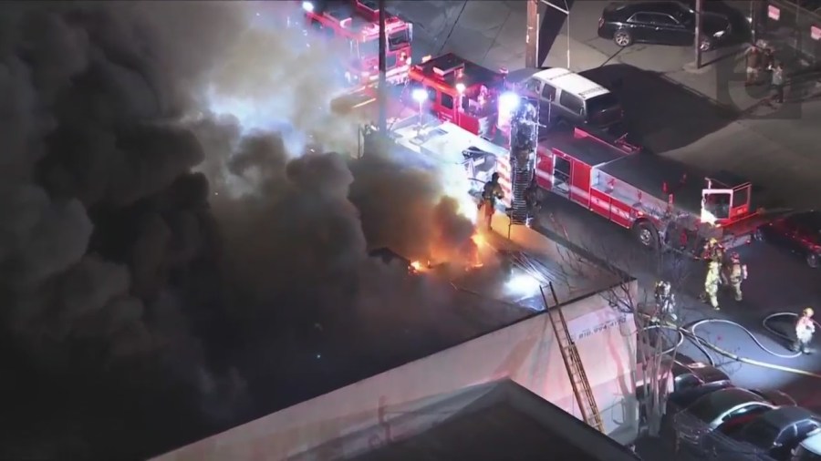 Crews tackled a large fire consuming a commercial building in Van Nuys on Feb. 16, 2023. (KTLA)