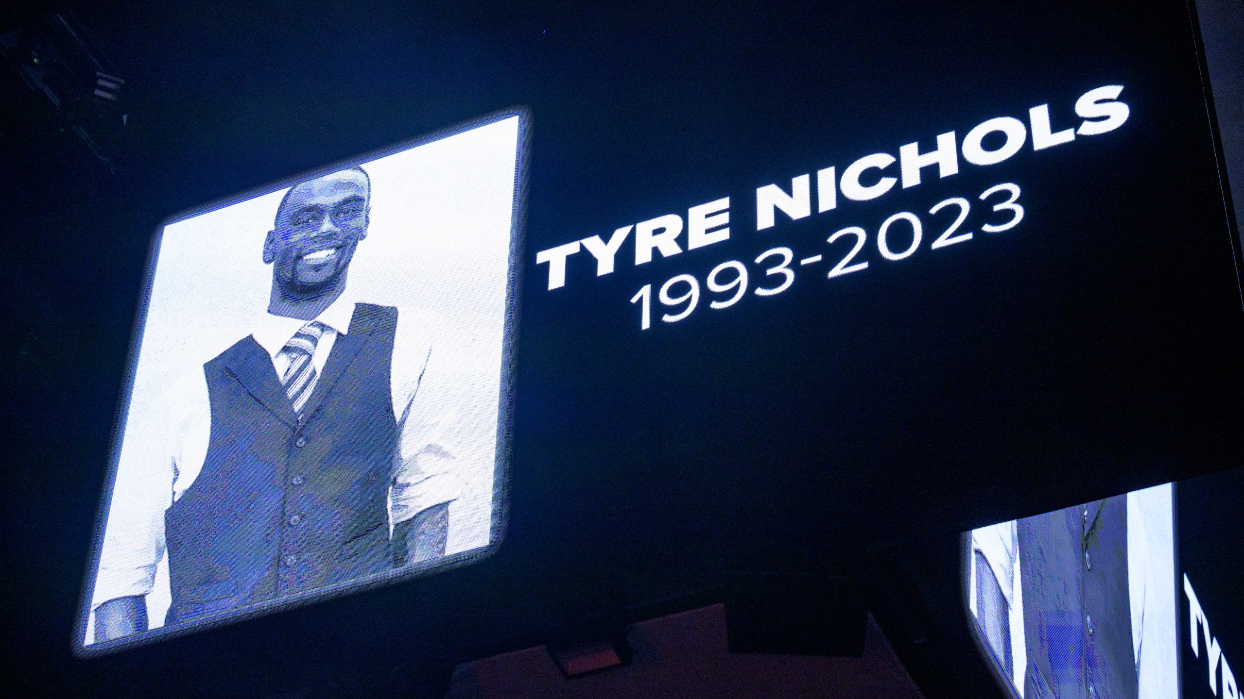 The screen at the Smoothie King Center honors Tyre Nichols before an NBA basketball game between the New Orleans Pelicans and the Washington Wizards in New Orleans, Saturday, Jan. 28, 2023. (AP Photo/Matthew Hinton)