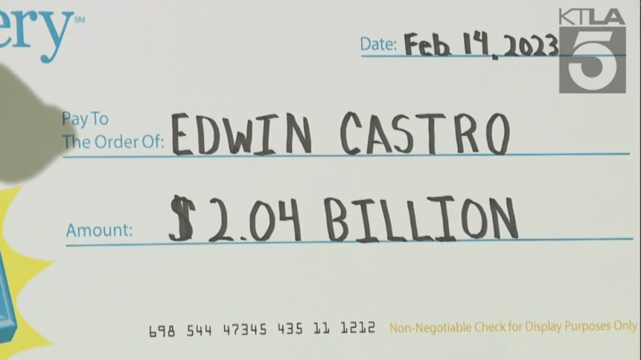 A check made out to Powerball Jackpot winner Edwin Castro is seen during a news conference on Feb. 14, 2023. (KTXL)