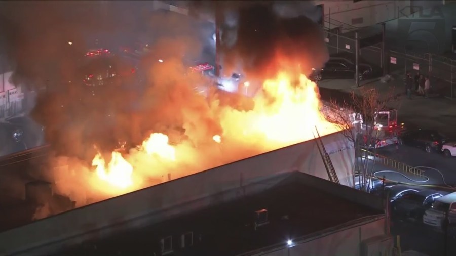 Crews tackled a large fire consuming a commercial building in Van Nuys on Feb. 16, 2023. (KTLA)