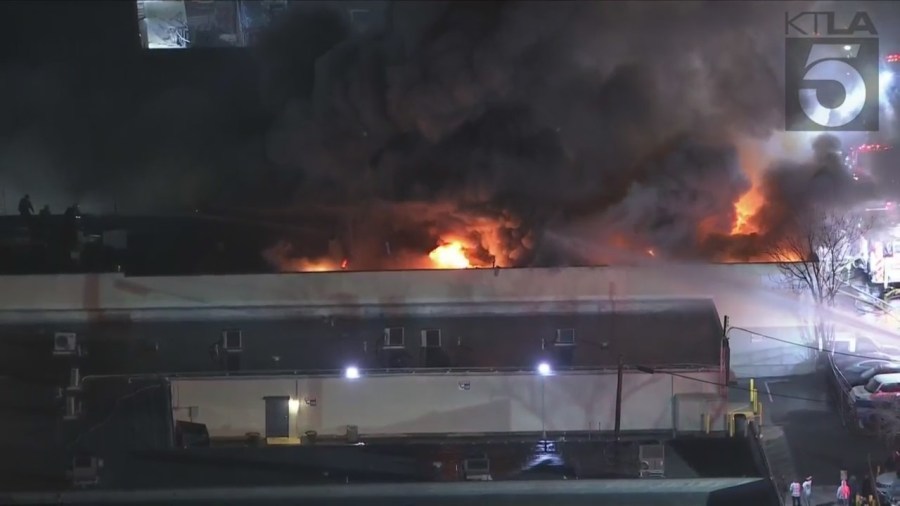 Crews tackled a large fire consuming a commercial building in Van Nuys on Feb. 16, 2023. (KTLA)