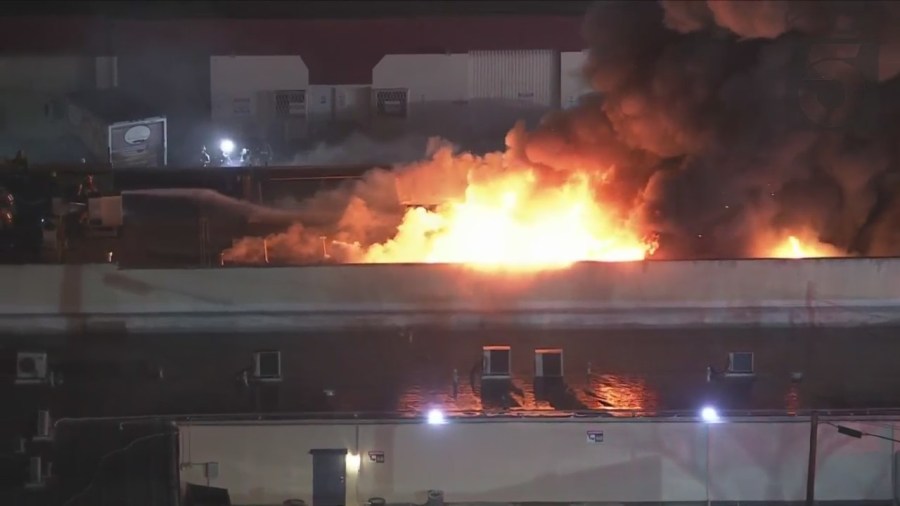 Crews tackled a large fire consuming a commercial building in Van Nuys on Feb. 16, 2023. (KTLA)