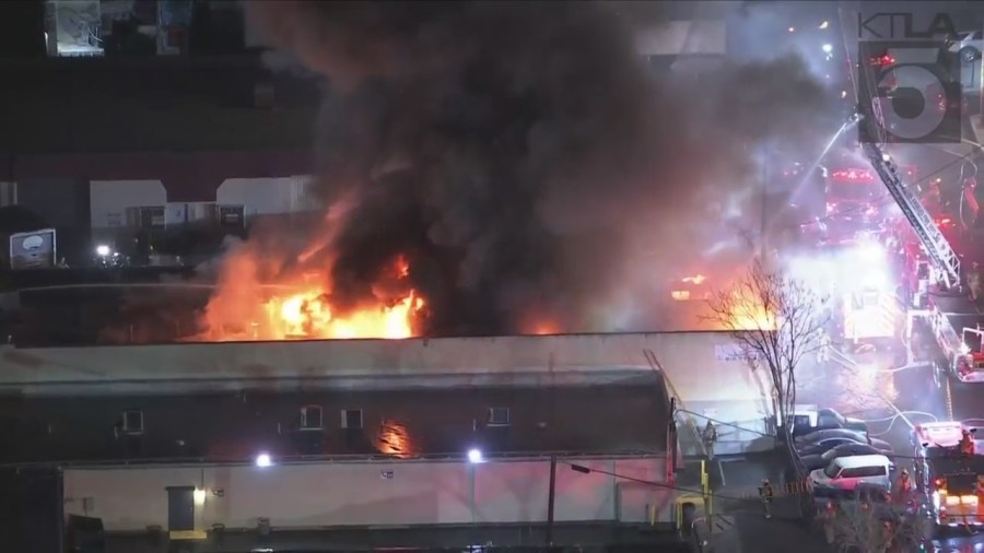 Crews tackled a large fire consuming a commercial building in Van Nuys on Feb. 16, 2023. (KTLA)