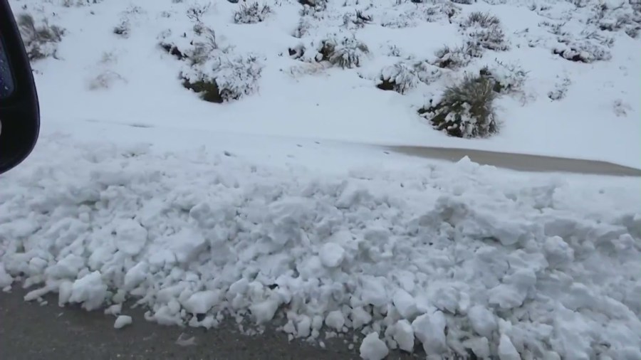 Snowplows clearing snow from the Grapevine as a winter storm batters Southern California.