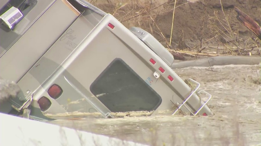 An RV tumbled off an embankment and into a river in Castaic on Feb. 25, 2023. (KTLA)