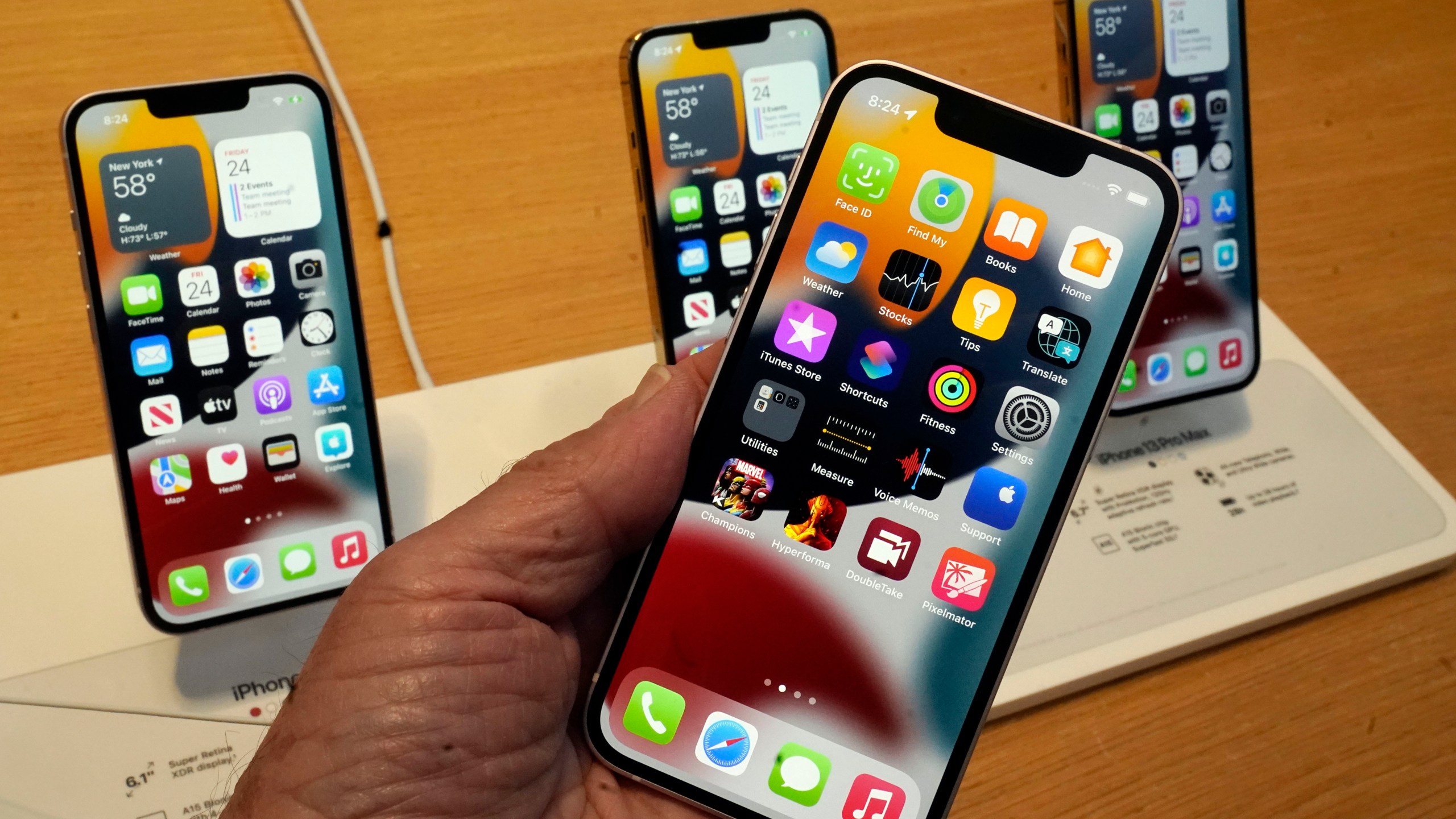 The line-up of the Apple iPhone 13 is displayed on their first day of sale, in New York on Sept. 24, 2021. (Richard Drew/Associated Press)