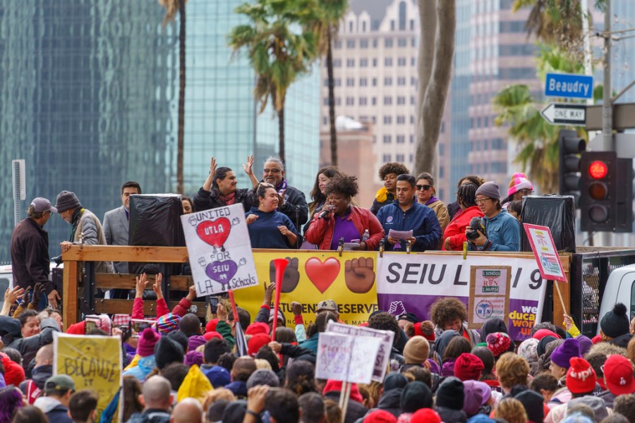 Union leaders address thousands of Los Angeles Unified School District teachers and Service Employees International Union 99 members during a rally outside the LAUSD headquarters in Los Angeles Tuesday, March 21, 2023. Thousands of service workers backed by teachers began a three-day strike against the Los Angeles Unified School District on Tuesday, shutting down education for a half-million students in the nation's second-largest school system. (AP Photo/Damian Dovarganes)