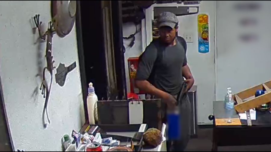 An armed man was captured on surveillance video on Mar. 20 using an unknown accelerant to start and spread a fire at Freeway Auto Parts in Santa Ana. (OCFA)