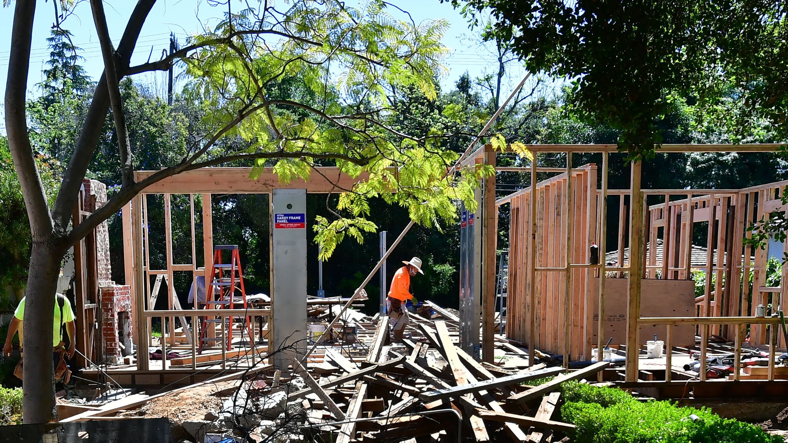 A construction worker walks through a site of a new house being built in San Marino, California on April 24, 2020. (Getty Images)