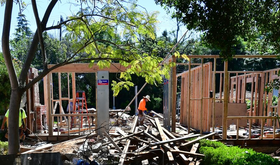 A construction worker walks through a site of a new house being built in San Marino, California on April 24, 2020. (Getty Images)