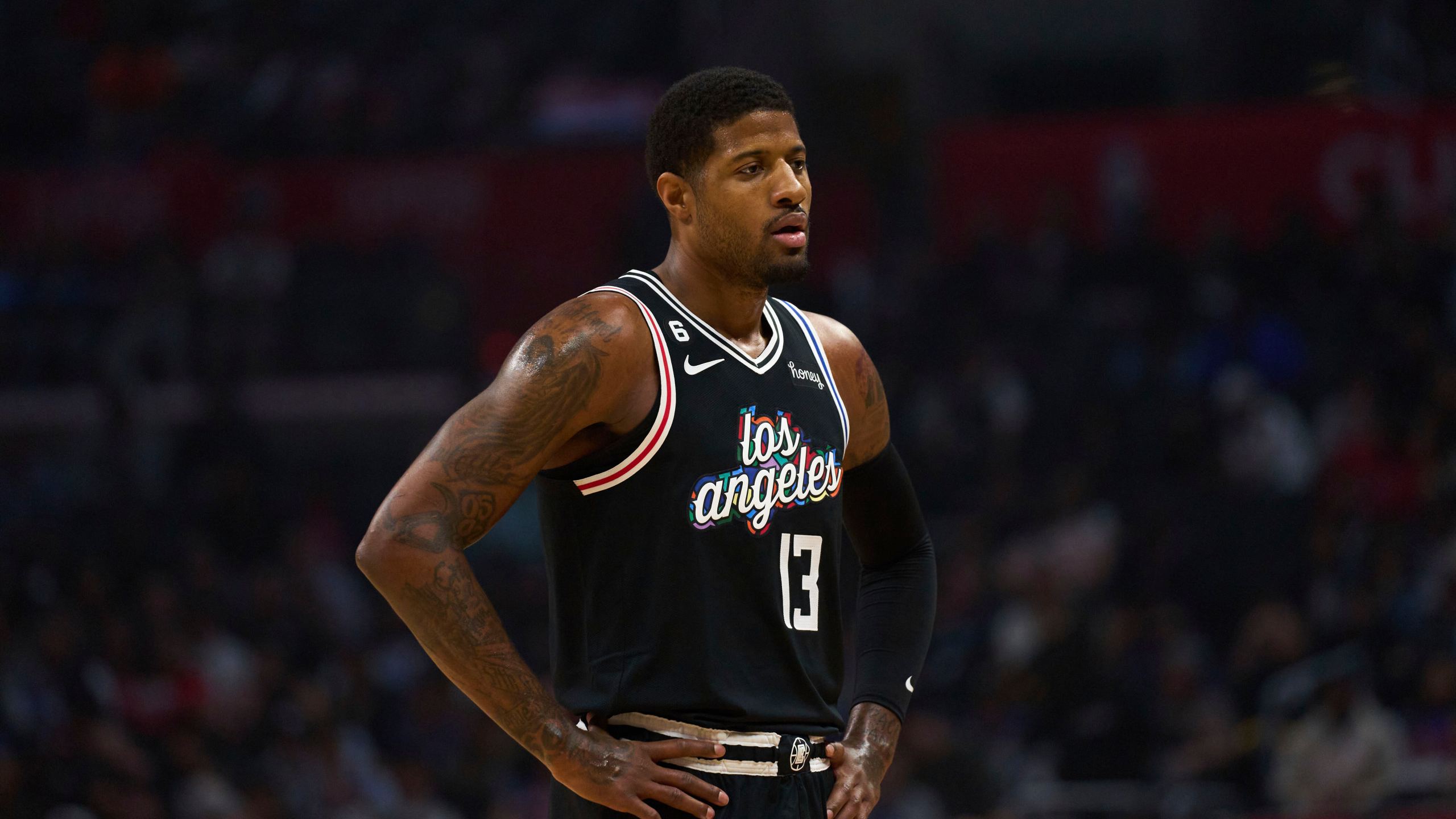 Los Angeles Clippers forward Paul George looks down the court during the first half of an NBA basketball game against the Orlando Magic Saturday, March 18, 2023, in Los Angeles. (AP Photo/Allison Dinner)