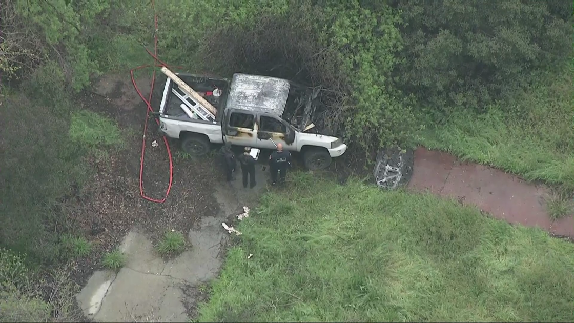 Police investigate a burned truck in Brea on March 23, 2023. (KTLA)